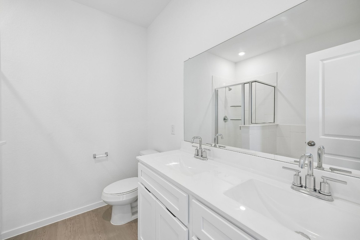 15023 Rustic Moon Road Conroe, TX 77302 - Photo 15 of 32 a bathroom with a sink toilet and shower