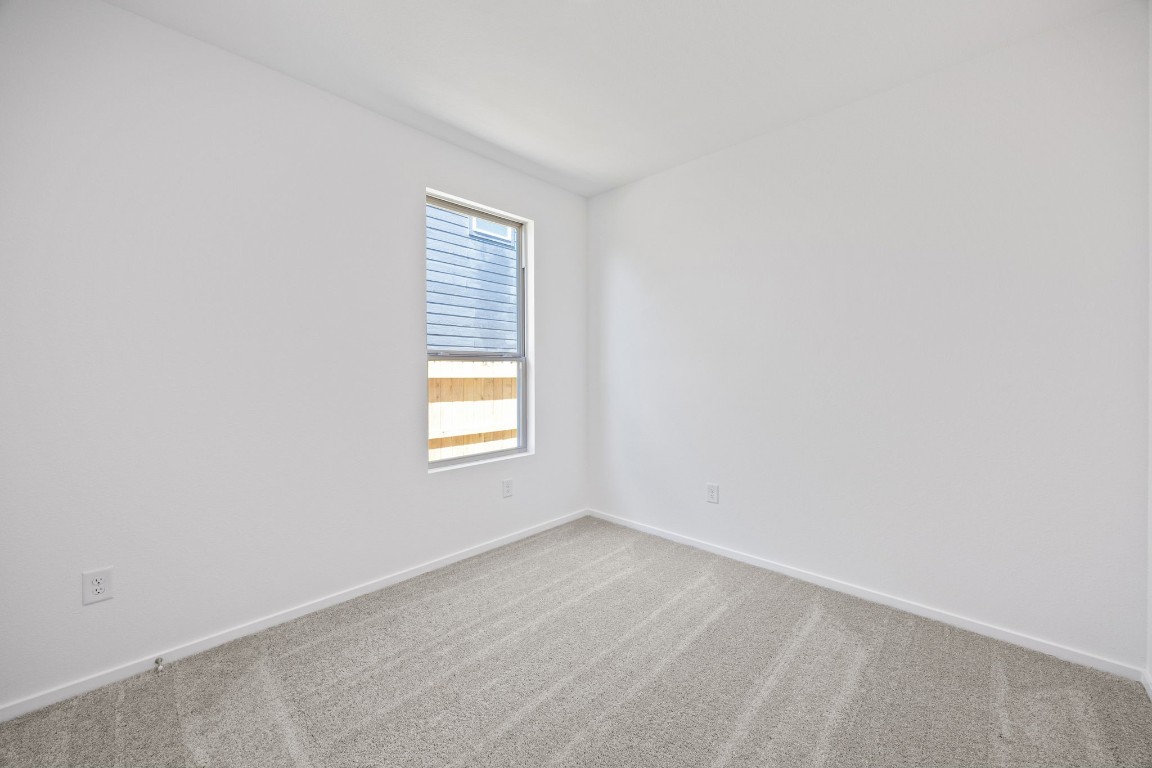 15023 Rustic Moon Road Conroe, TX 77302 - Photo 17 of 32 an empty room with a window