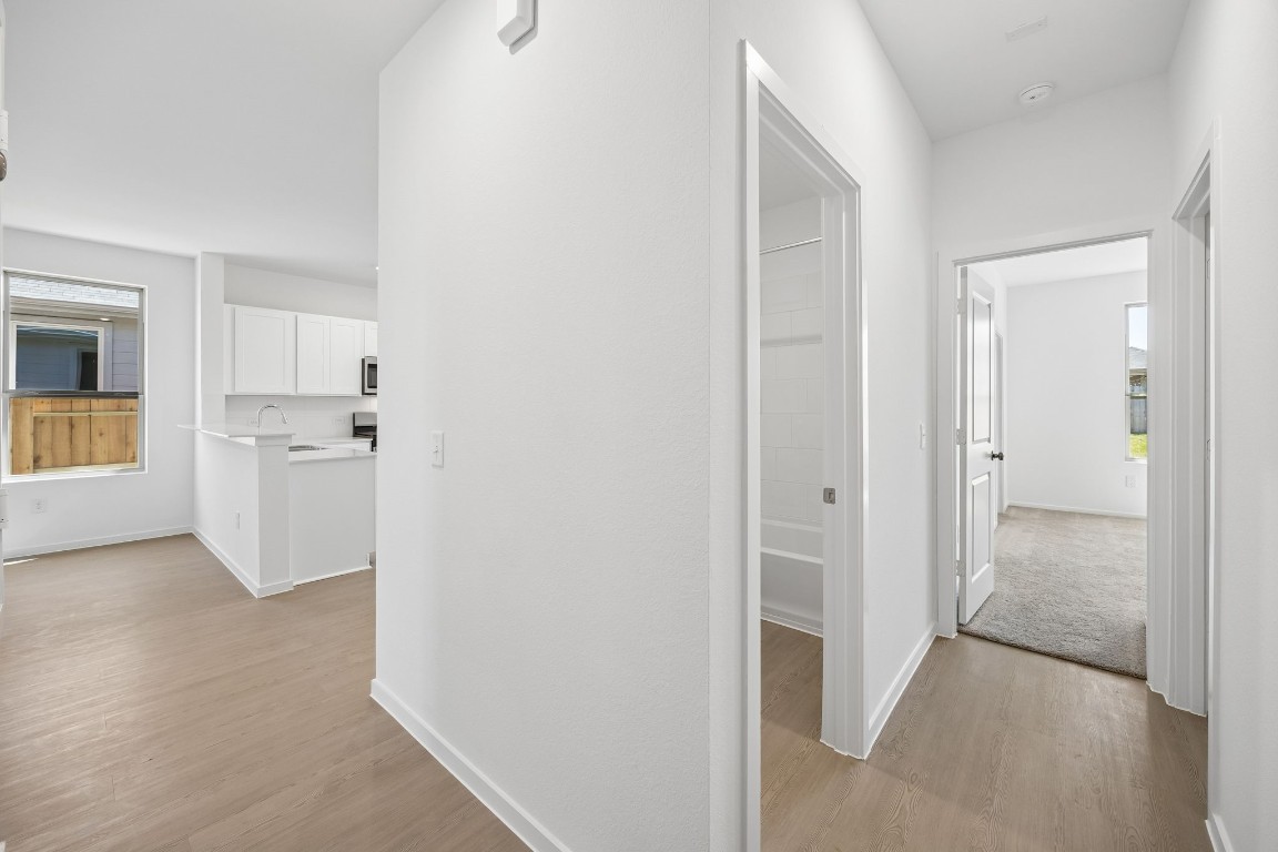 15023 Rustic Moon Road Conroe, TX 77302 - Photo 23 of 32 a view of a kitchen with a refrigerator and a sink