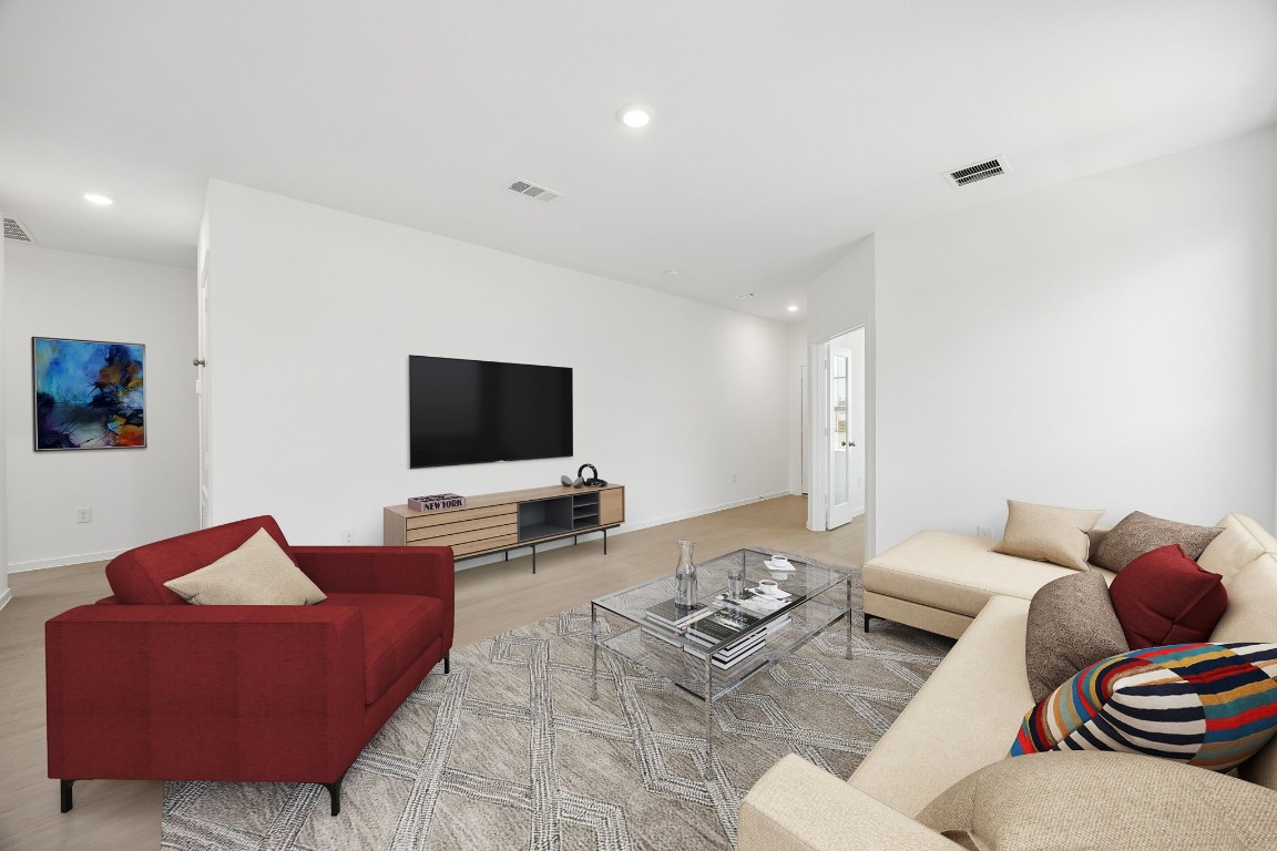 15023 Rustic Moon Road Conroe, TX 77302 - Photo 28 of 32 a living room with furniture and a flat screen tv