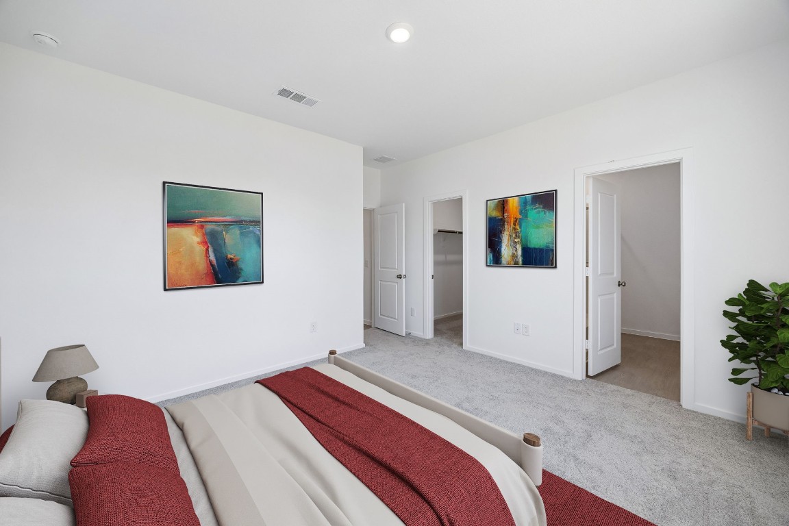 15023 Rustic Moon Road Conroe, TX 77302 - Photo 32 of 32 a bedroom with a bed and a painting