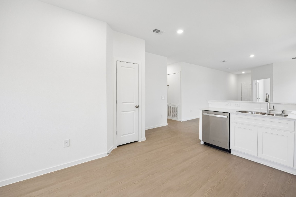 15023 Rustic Moon Road Conroe, TX 77302 - Photo 8 of 32 a view of a kitchen with white cabinets and white appliances