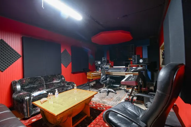 a backyard of a house with outdoor seating