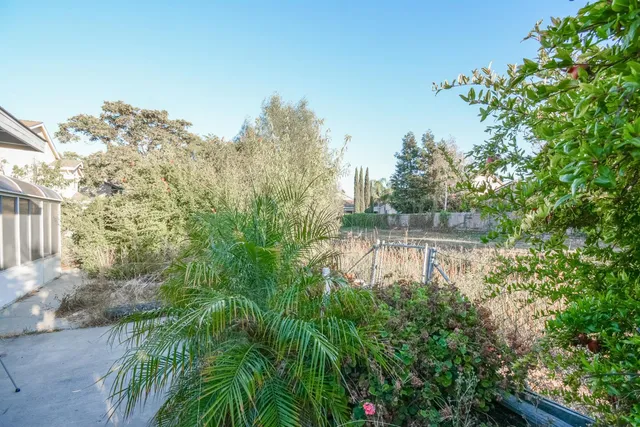 an aerial view of a house with a garden