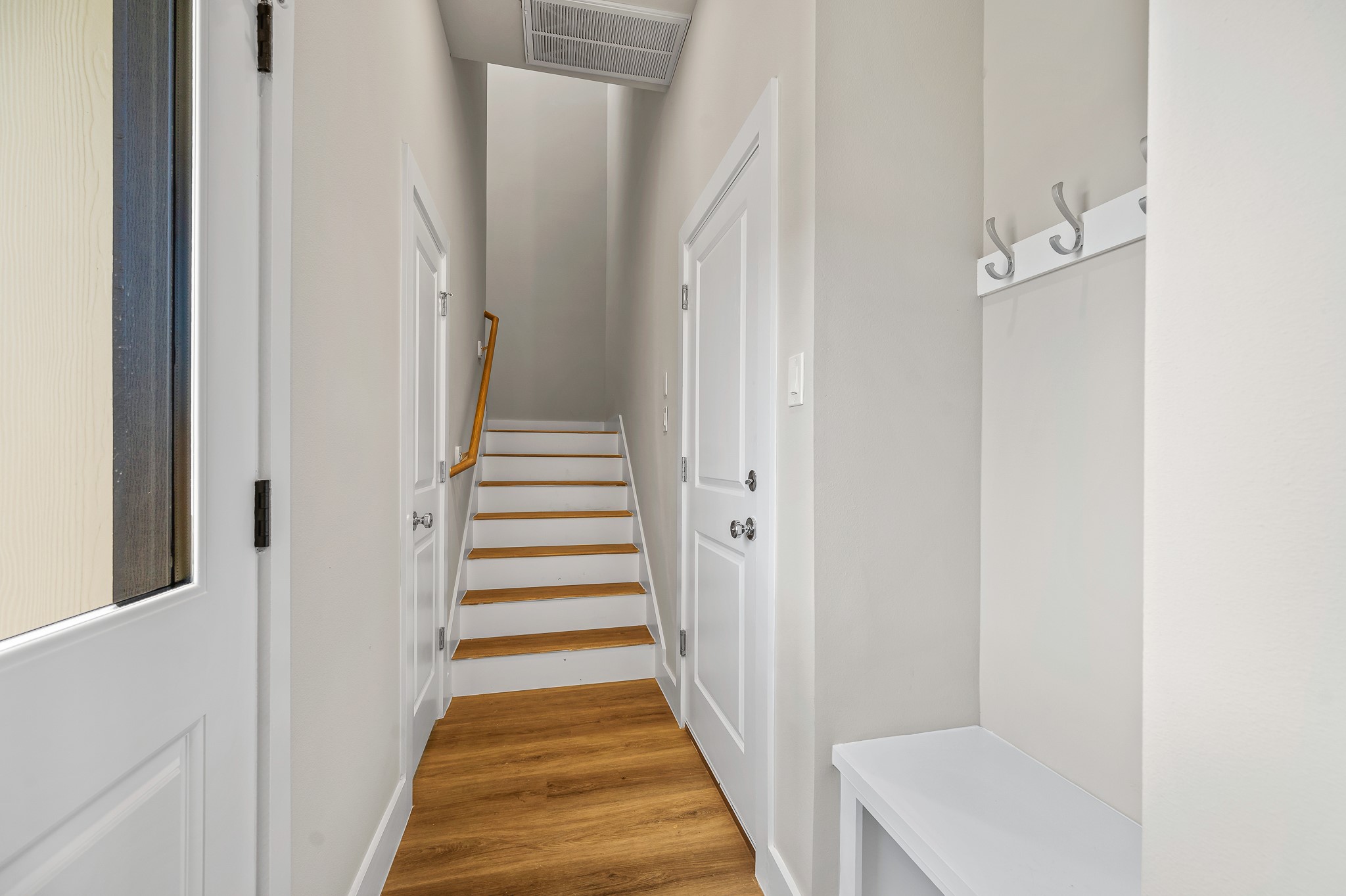 6702 Metro Boulevard, Unit 12 Houston, TX 77083 - Photo 12 of 48 a view of a hallway with wooden floor and entryway