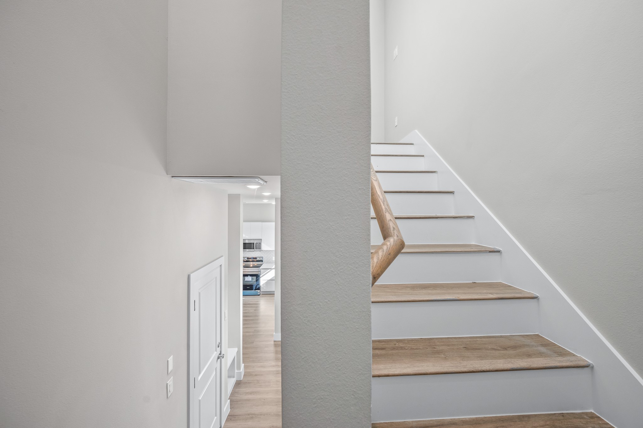 6702 Metro Boulevard, Unit 12 Houston, TX 77083 - Photo 13 of 48 a view of staircase with white walls and white door