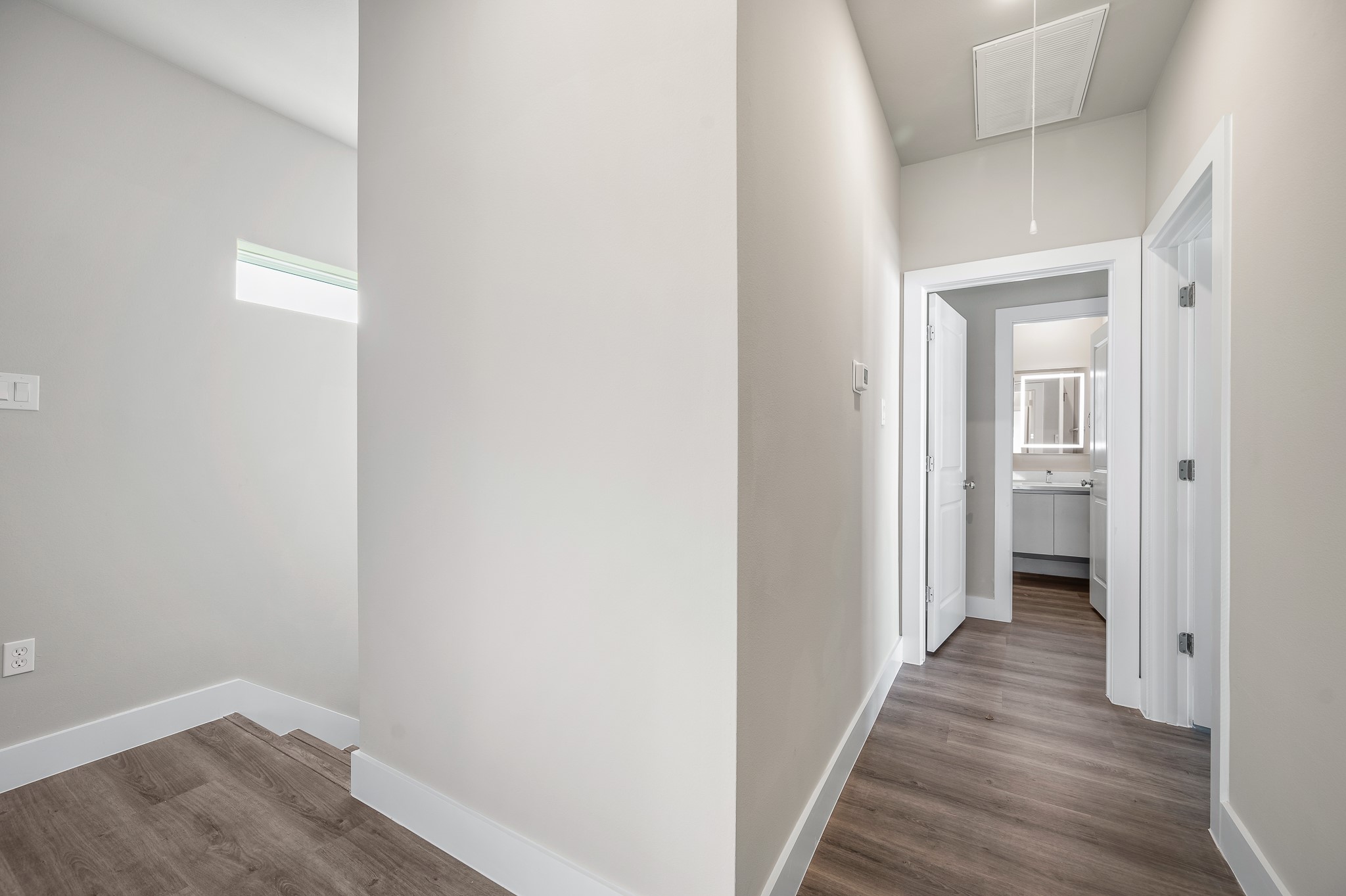 6702 Metro Boulevard, Unit 12 Houston, TX 77083 - Photo 24 of 48 a view of a hallway with wooden floor