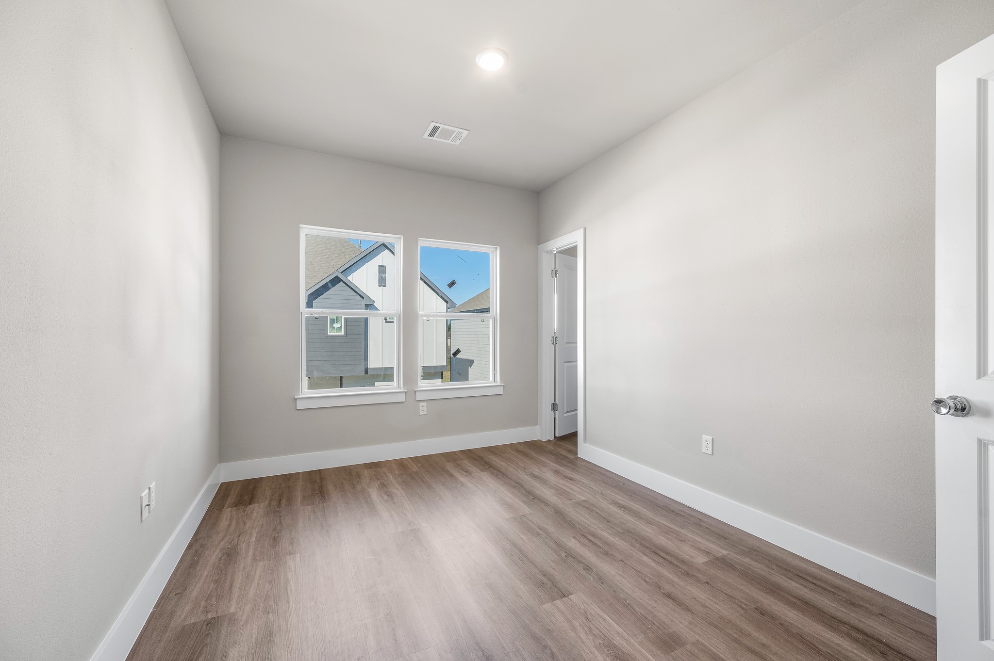 6702 Metro Boulevard, Unit 12 Houston, TX 77083 - Photo 25 of 48 a view of room with window and hardwood floor