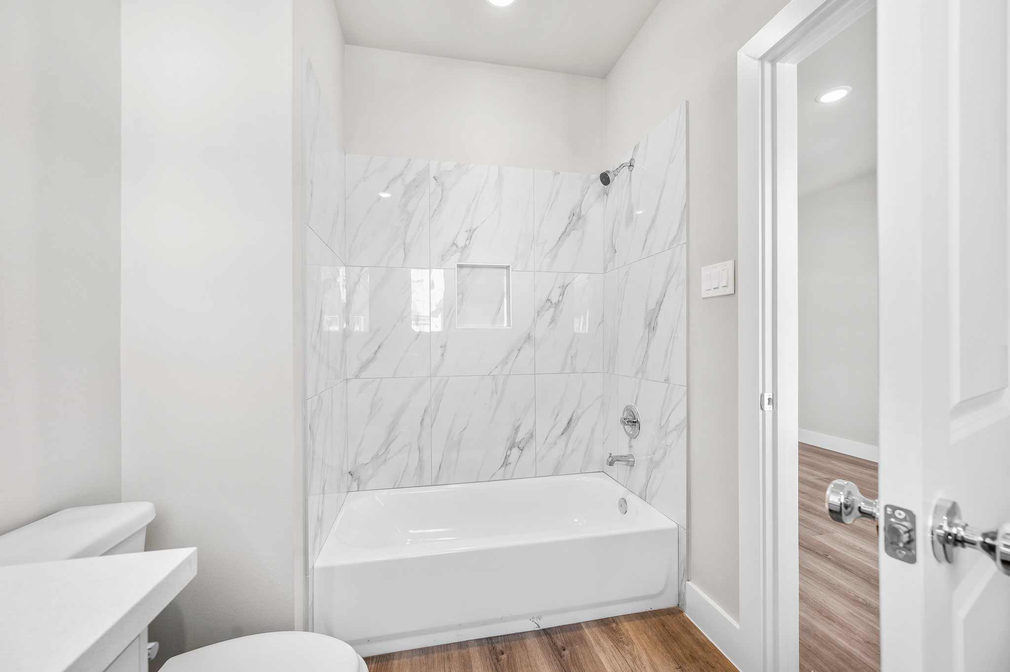 6702 Metro Boulevard, Unit 12 Houston, TX 77083 - Photo 28 of 48 a bathroom with a bathtub and toilet