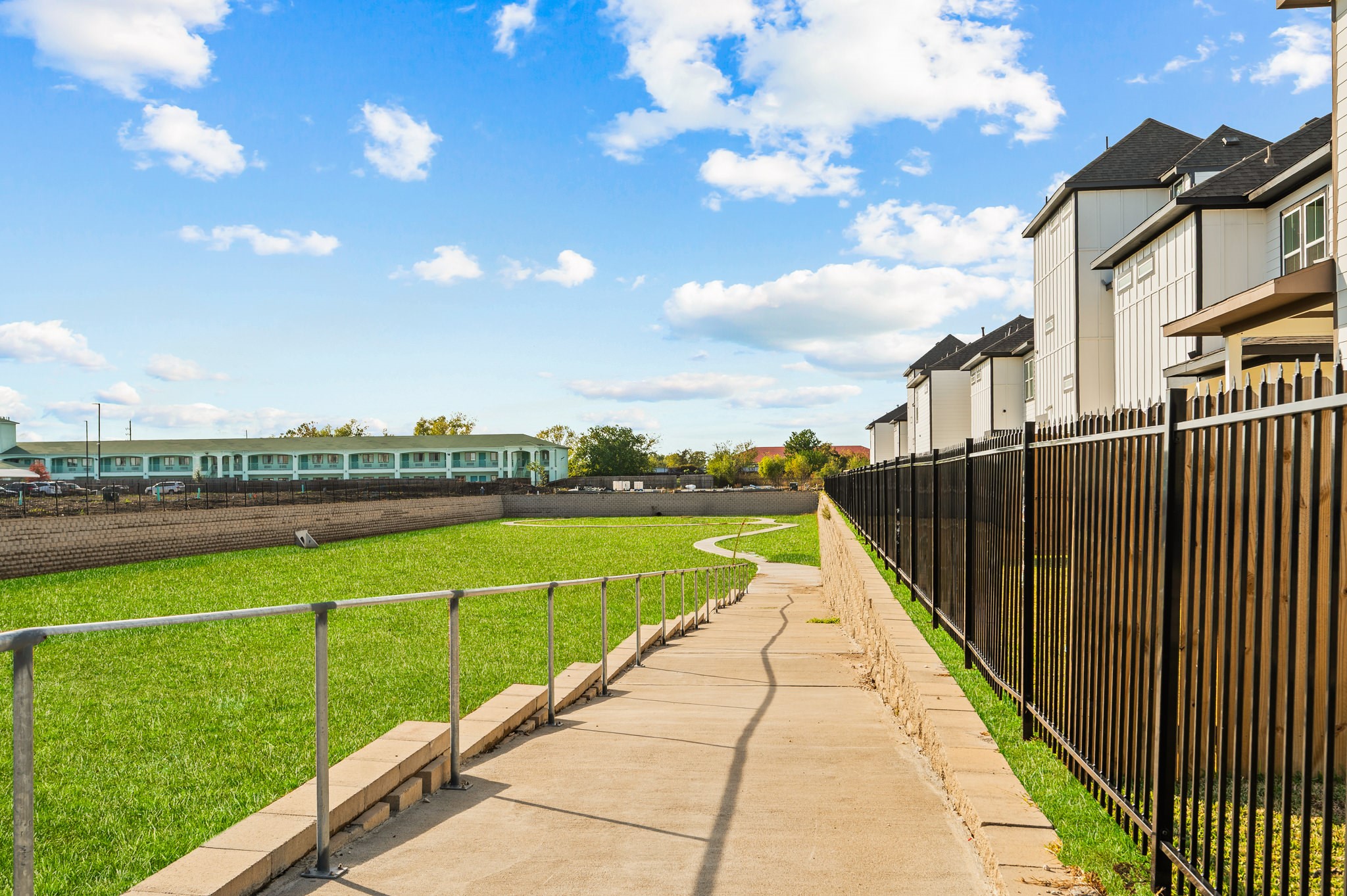 6702 Metro Boulevard, Unit 12 Houston, TX 77083 - Photo 47 of 48 a view of swimming pool with a garden