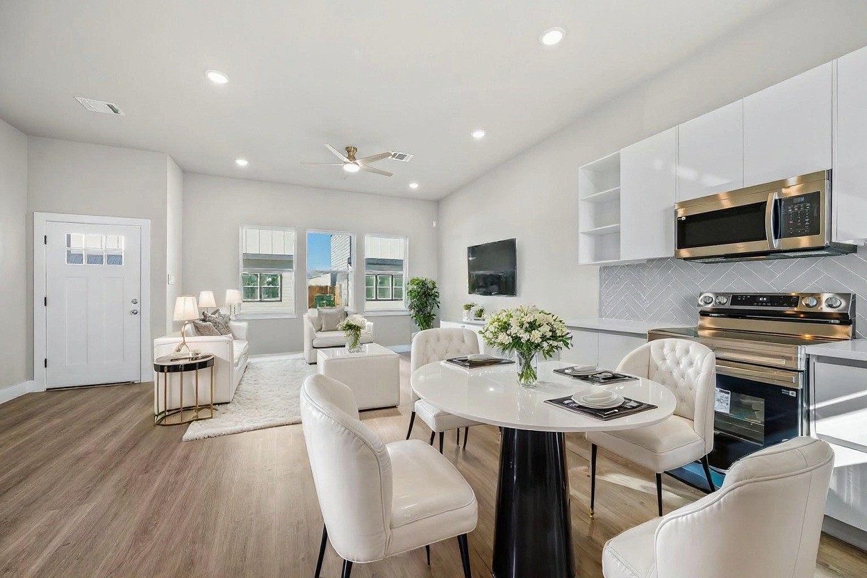 6702 Metro Boulevard, Unit 12 Houston, TX 77083 - Photo 9 of 48 a view of a dining room with furniture window and wooden floor