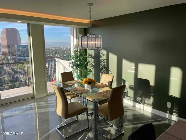 a large kitchen with a table and chairs