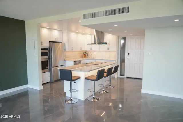 a view of a livingroom with furniture and lounge chair