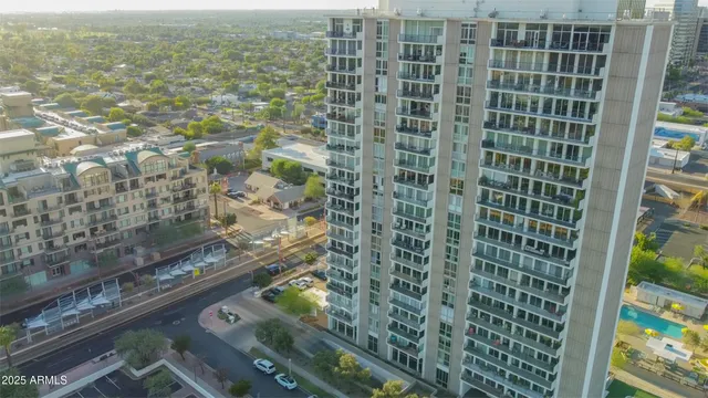 a bathroom with a granite countertop sink toilet a mirror and bathtub