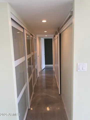 a bathroom with a granite countertop sink a toilet and shower