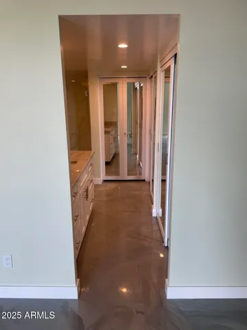 a kitchen with stainless steel appliances granite countertop a sink a stove and a refrigerator