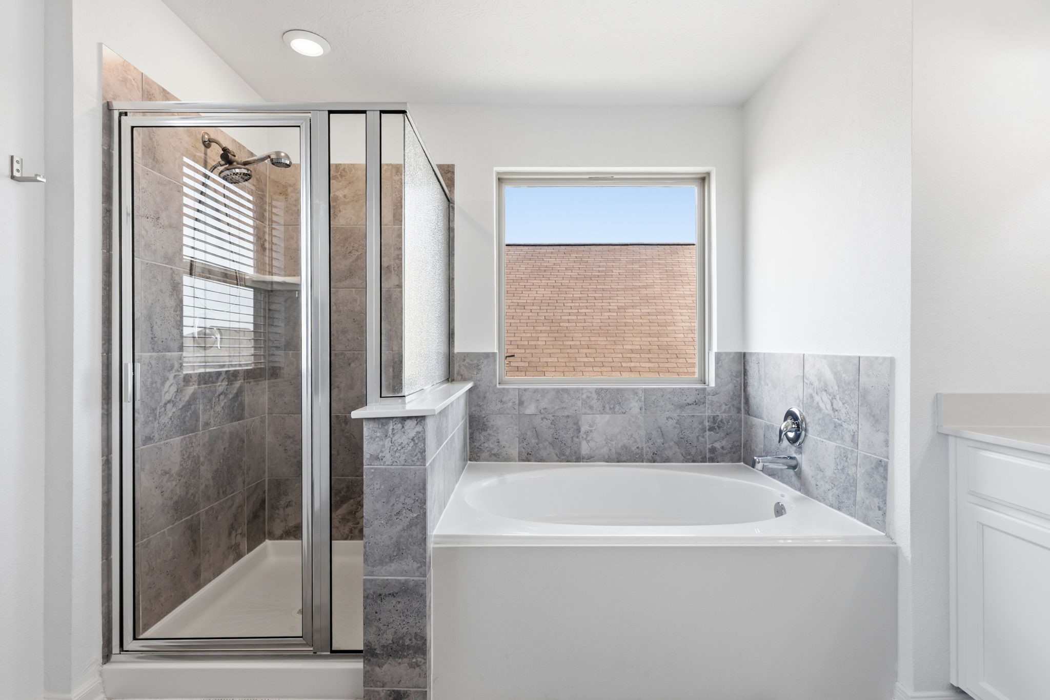 5127 Avondale Rise Street Katy, TX 77493 - Photo 27 of 47 a bathroom with a bathtub and a shower