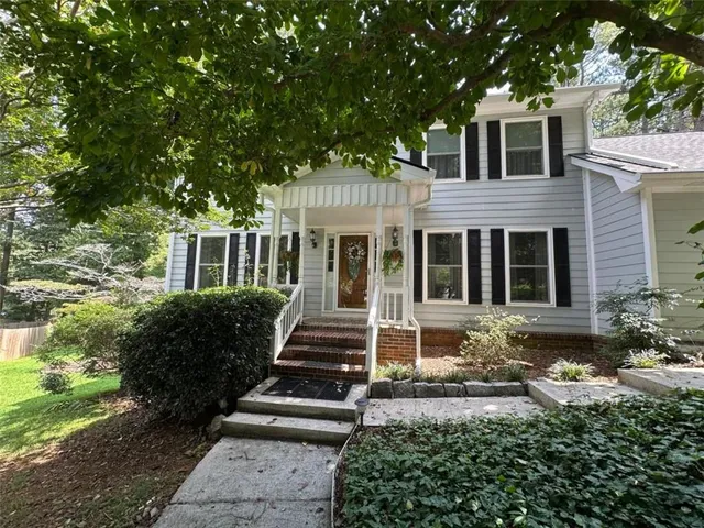 front view of a house with a yard