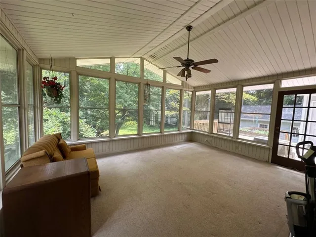 a view of livingroom with furniture and floor to ceiling window