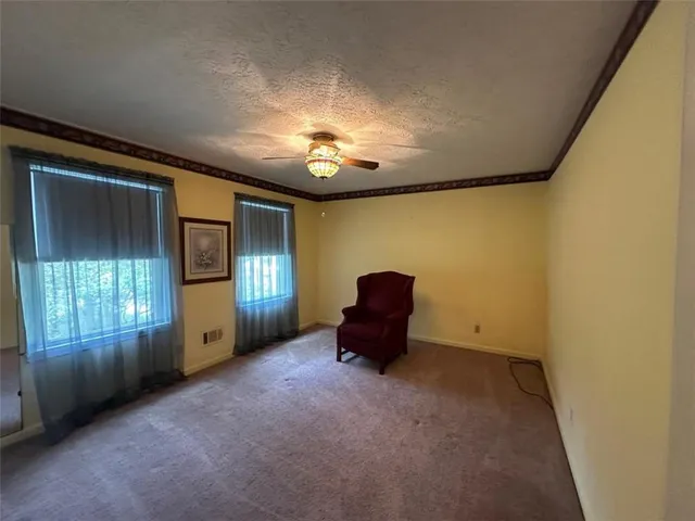 a view of empty room with a window