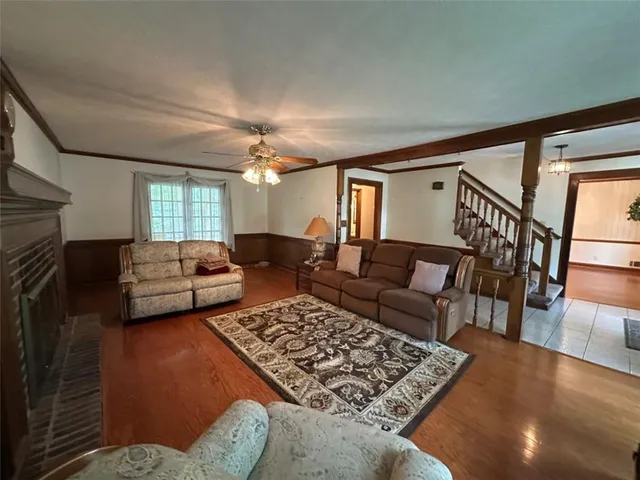a living room with furniture rug and window