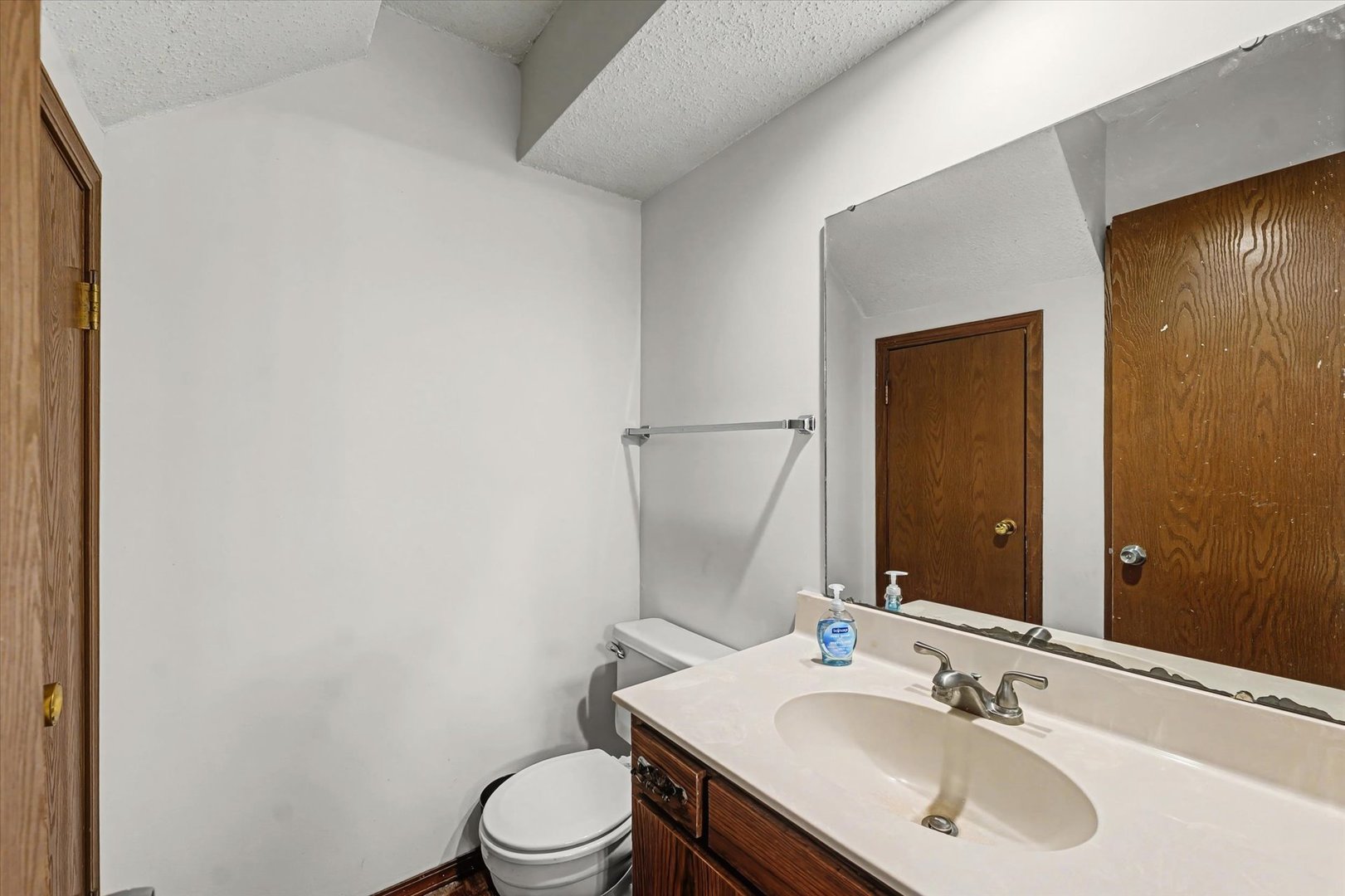 2111 Sunview Drive, Unit 2111 Champaign, IL 61821 - Photo 15 of 28 a bathroom with a sink toilet and mirror