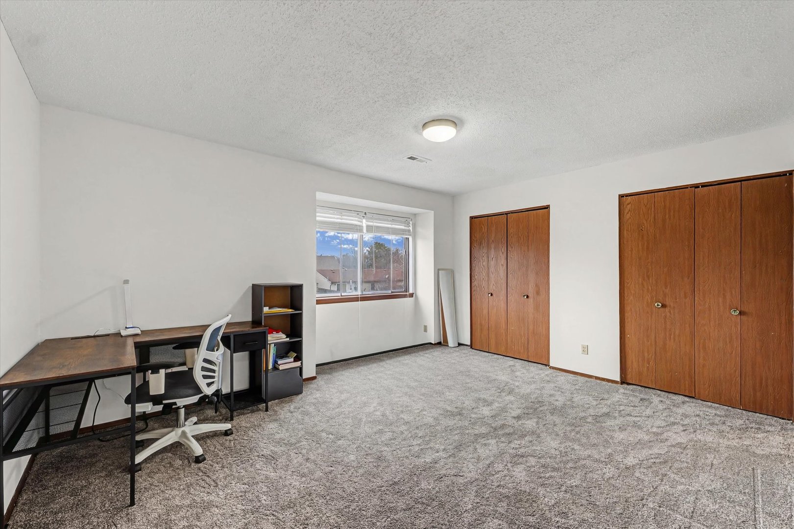 2111 Sunview Drive, Unit 2111 Champaign, IL 61821 - Photo 17 of 28 a view of a workspace with furniture and a window