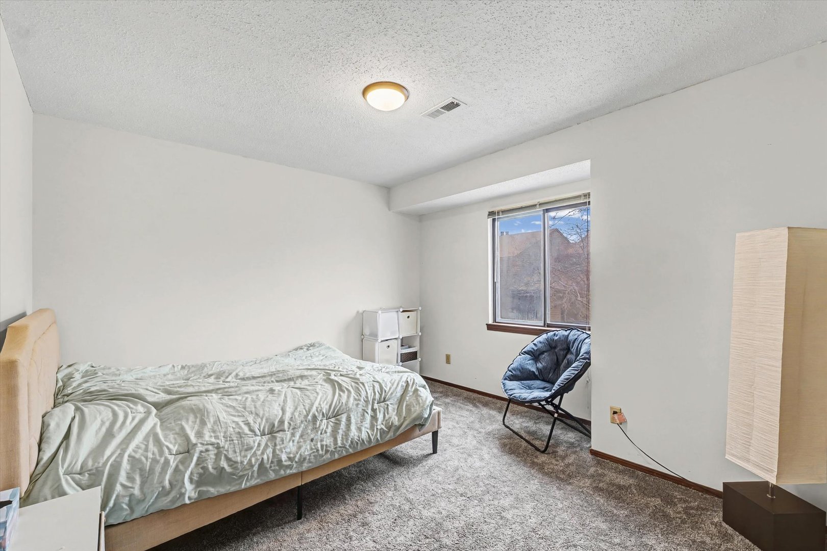 2111 Sunview Drive, Unit 2111 Champaign, IL 61821 - Photo 20 of 28 a bedroom with a bed and wooden floor