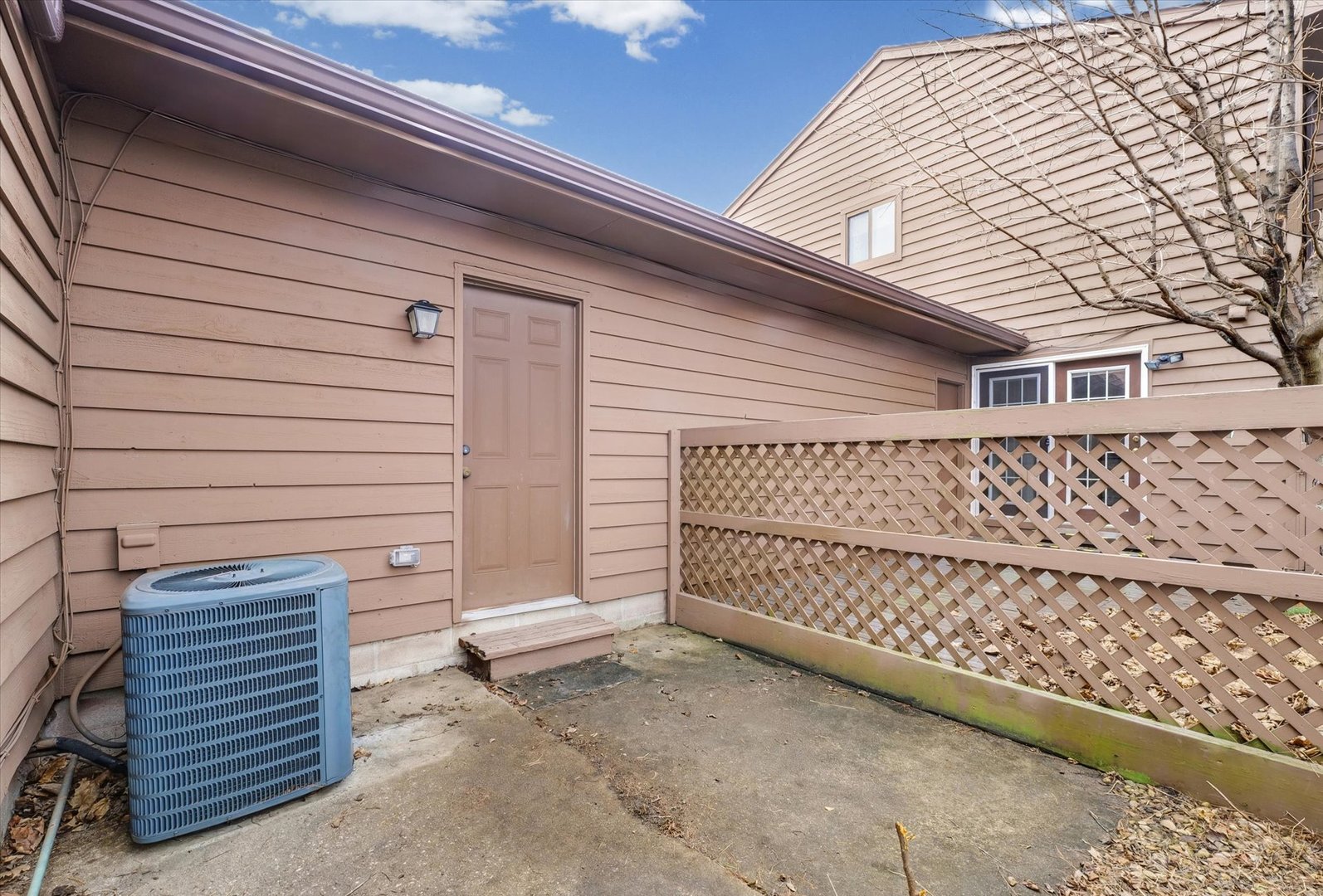 2111 Sunview Drive, Unit 2111 Champaign, IL 61821 - Photo 25 of 28 a view of a house with wooden fence