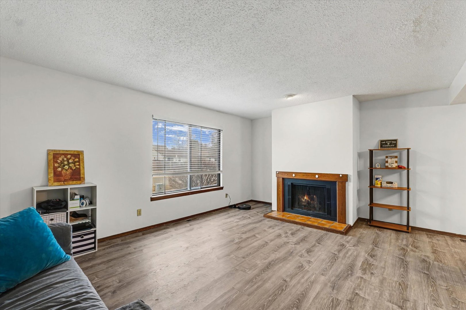 2111 Sunview Drive, Unit 2111 Champaign, IL 61821 - Photo 6 of 28 a view of an empty room with a fireplace and a window