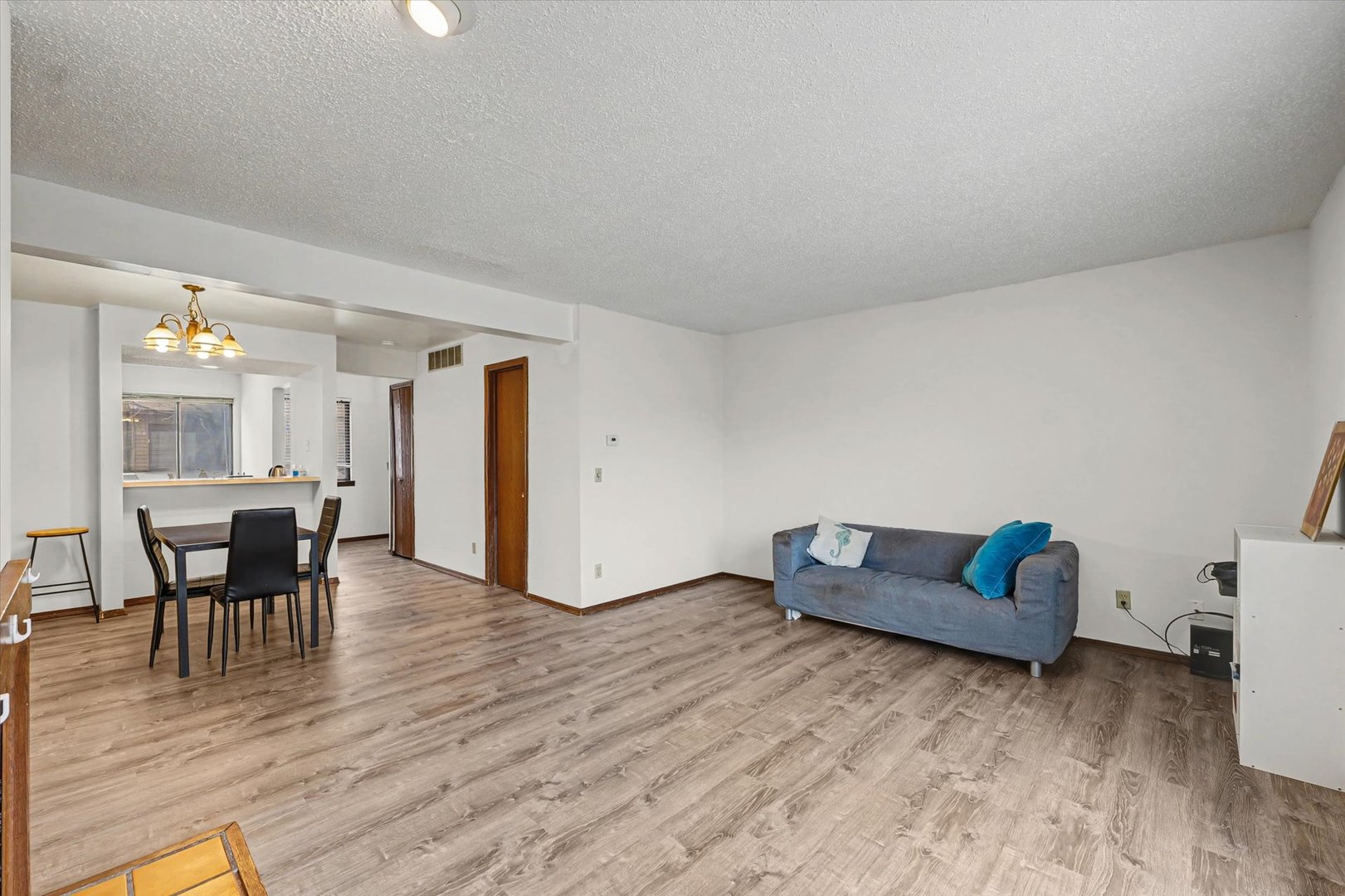 2111 Sunview Drive, Unit 2111 Champaign, IL 61821 - Photo 7 of 28 a living room with furniture and a wooden floor