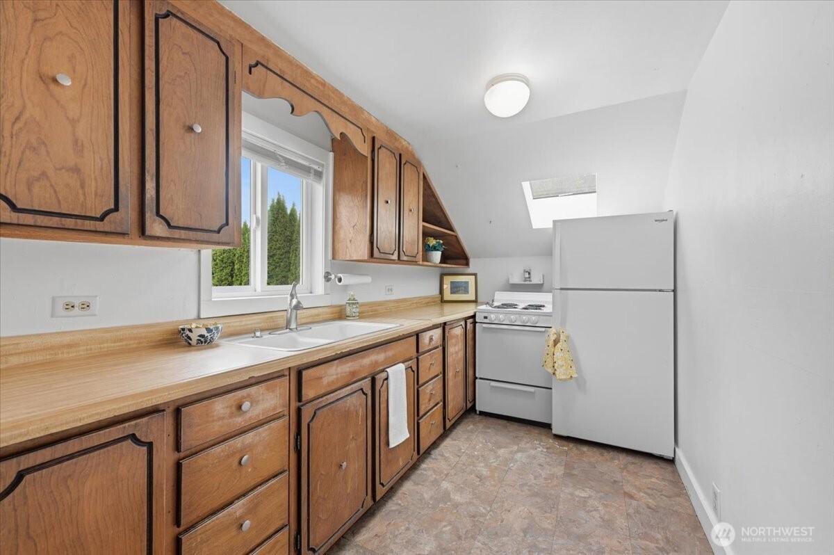 23746 Old Day Creek Road, Unit A & B Sedro-Woolley, WA 98284 - Photo 25 of 36 a utility room with cabinets washer and dryer