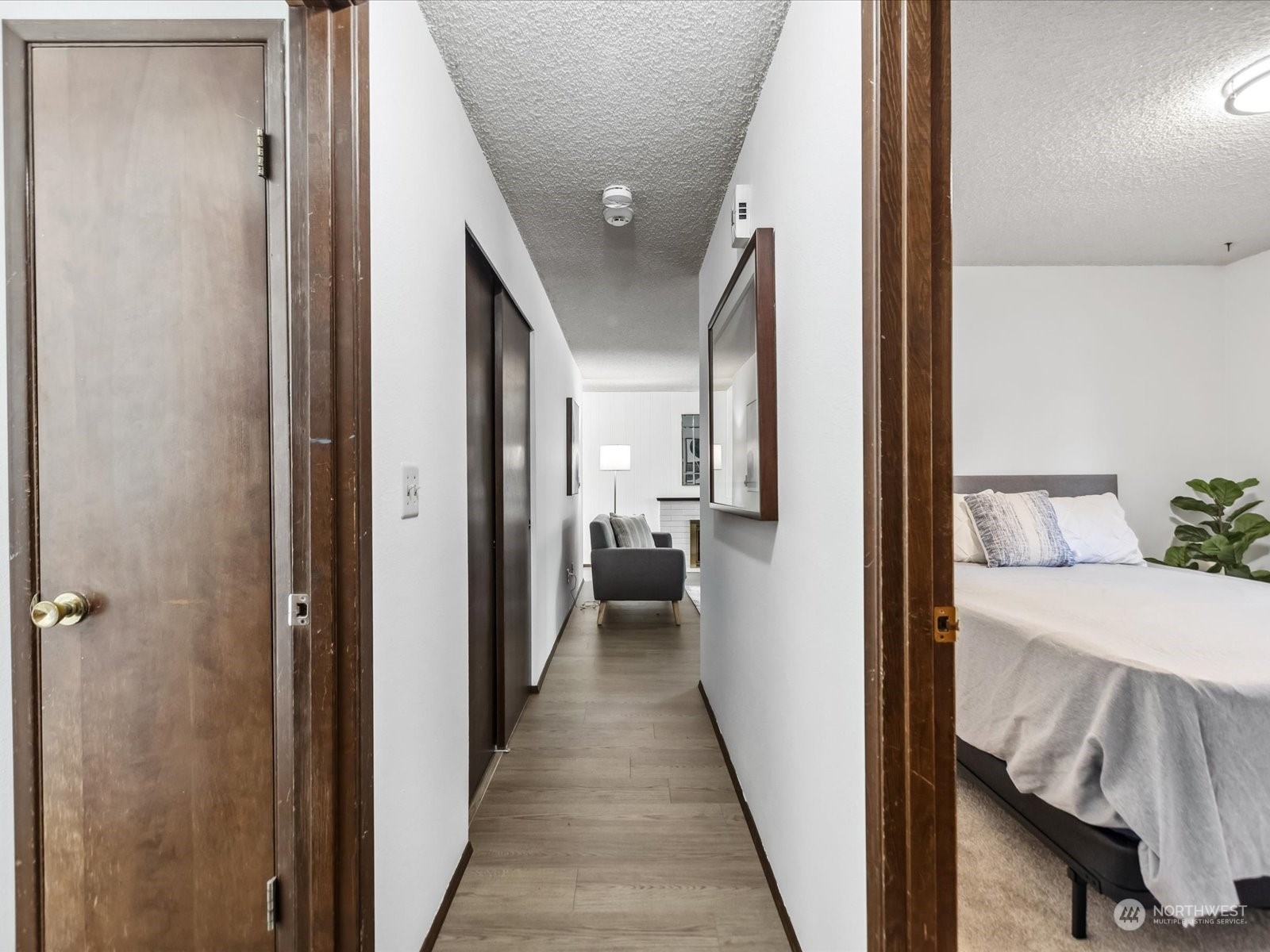 4330 200th Street Southeast Bothell, WA 98012 - Photo 14 of 36 a view of a hallway with a livingroom and furniture