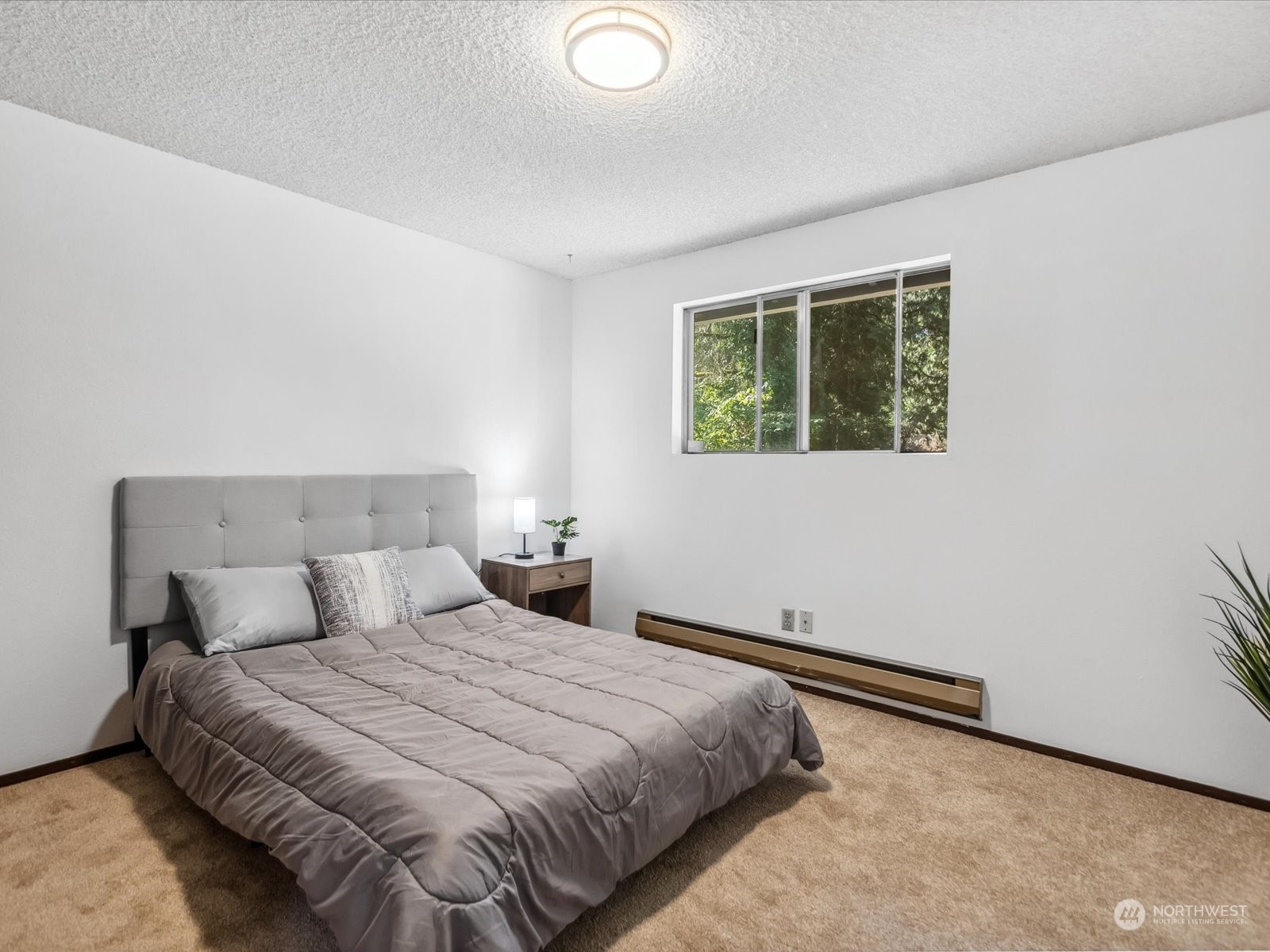 4330 200th Street Southeast Bothell, WA 98012 - Photo 16 of 36 a bedroom with a bed and a window