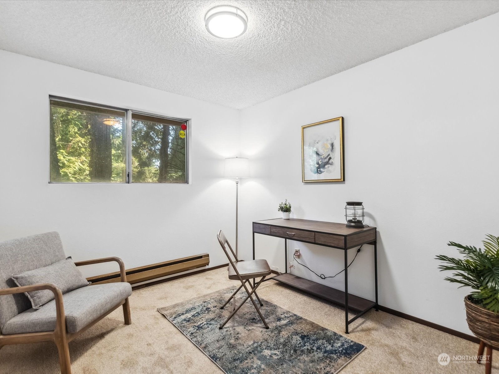 4330 200th Street Southeast Bothell, WA 98012 - Photo 17 of 36 a view of a livingroom with furniture and a potted plant