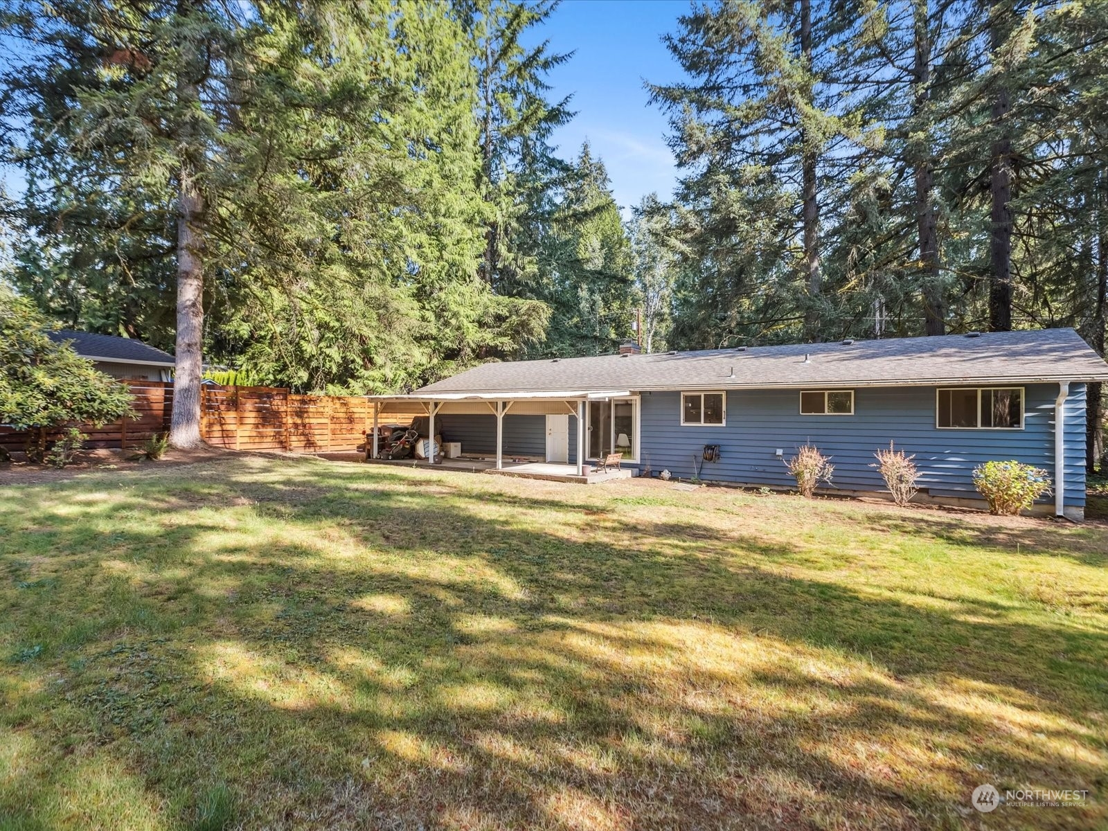4330 200th Street Southeast Bothell, WA 98012 - Photo 22 of 36 a front view of a house with a garden