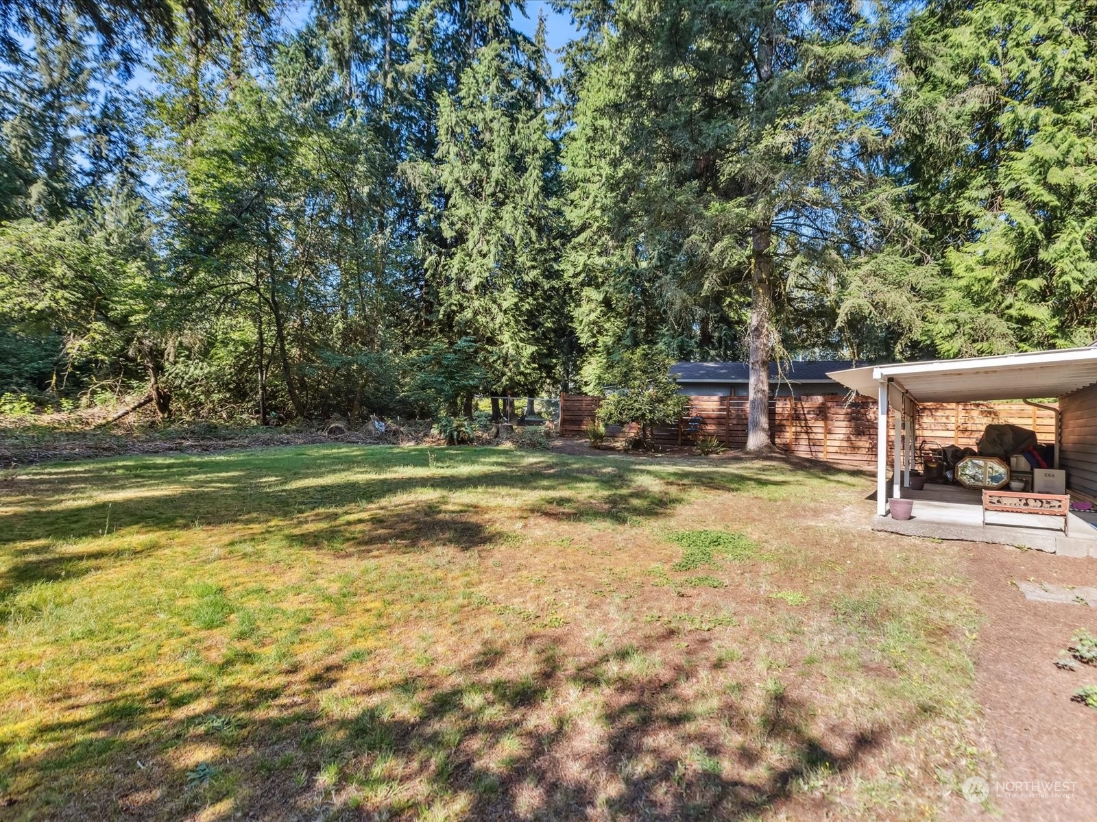 4330 200th Street Southeast Bothell, WA 98012 - Photo 25 of 36 a view of backyard with swimming pool and seating space