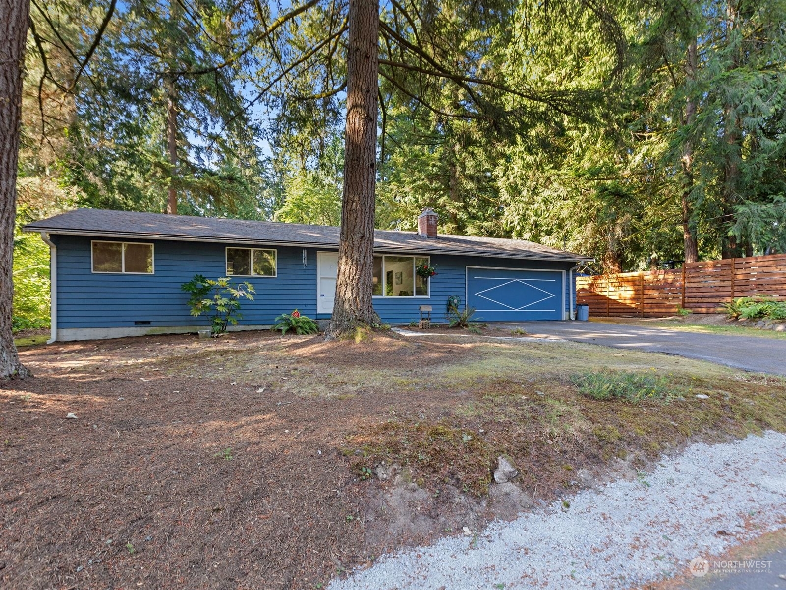 4330 200th Street Southeast Bothell, WA 98012 - Photo 29 of 36 a front view of a house with garden