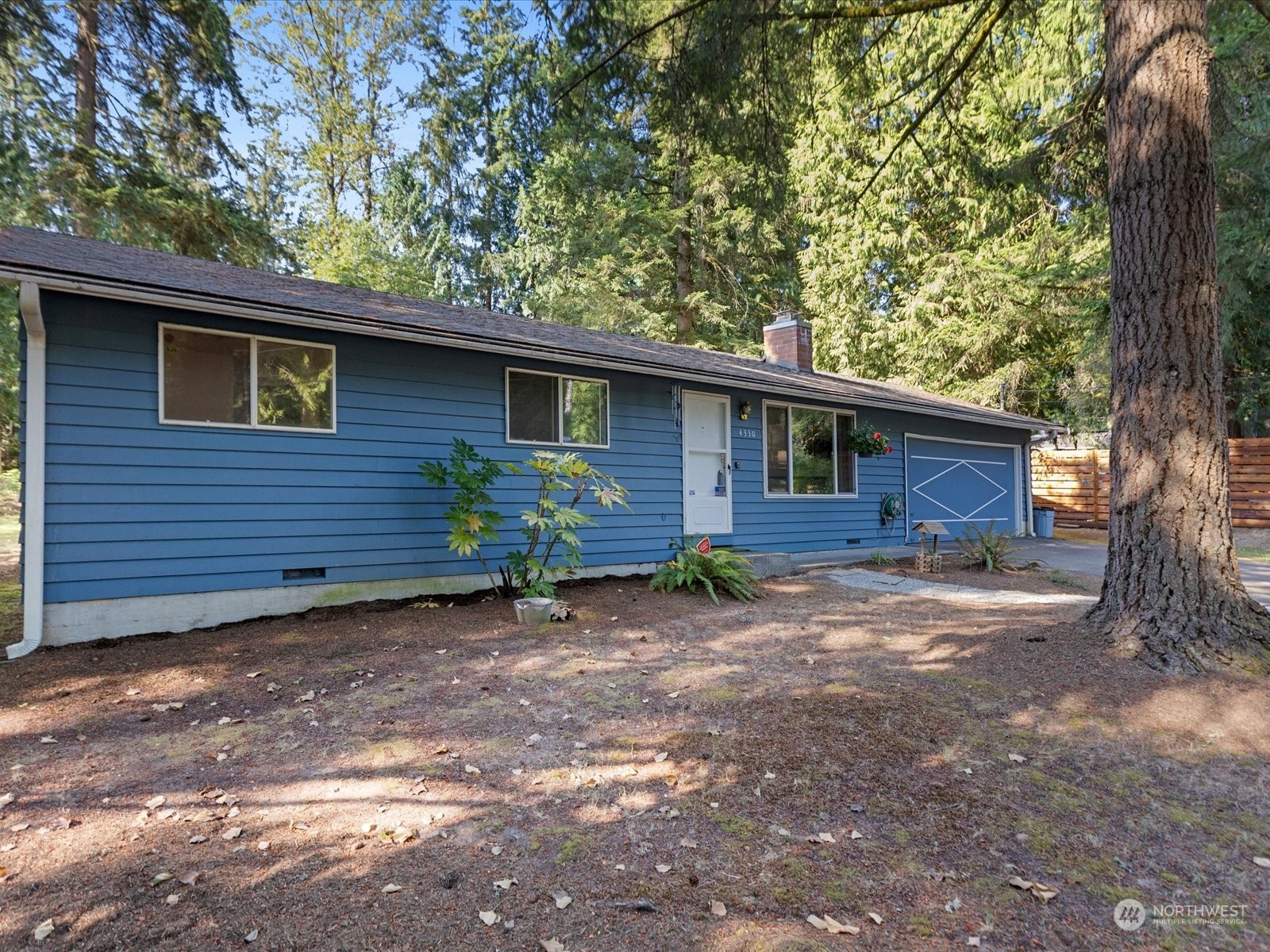 4330 200th Street Southeast Bothell, WA 98012 - Photo 3 of 36 a view of a house with a yard