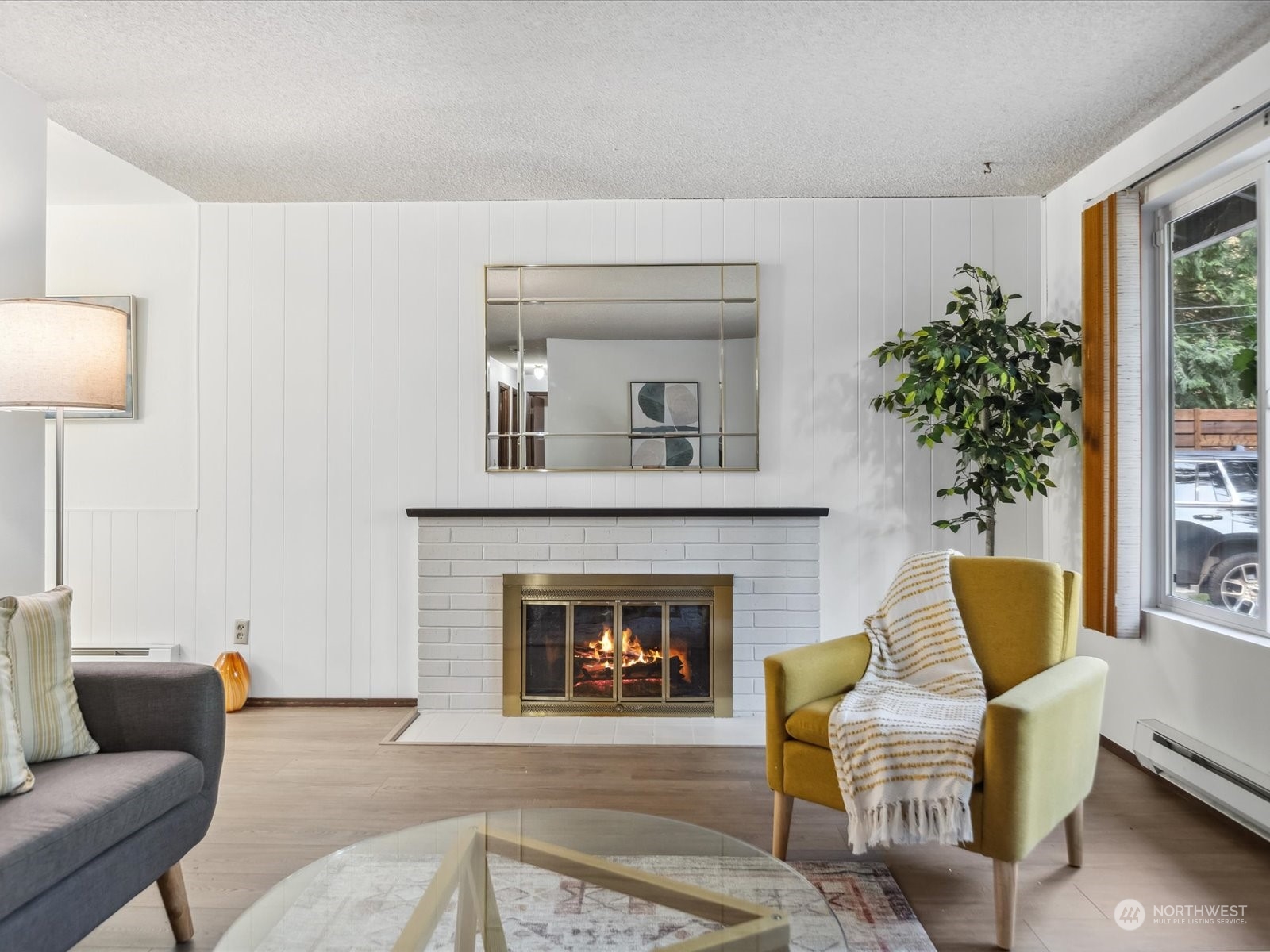 4330 200th Street Southeast Bothell, WA 98012 - Photo 7 of 36 a living room with furniture and a fireplace