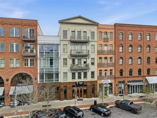 a front view of a building with parking space