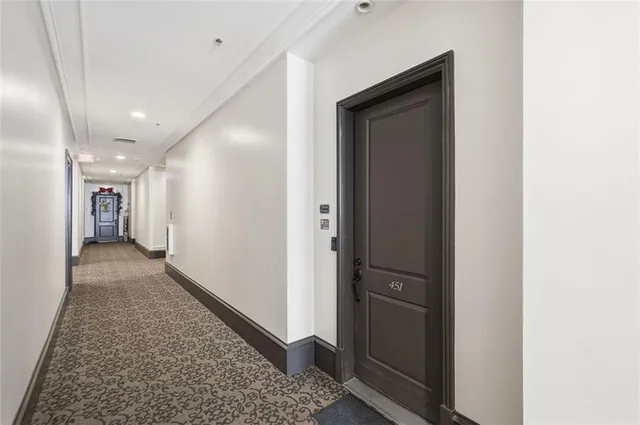 a view of walk in closet with rug