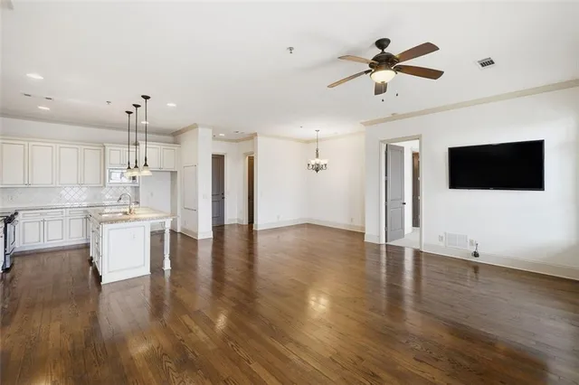 a view of kitchen with a refrigerator and wooden floor