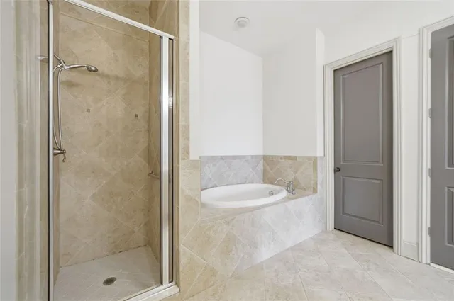 a bathroom with a double vanity sink and mirror