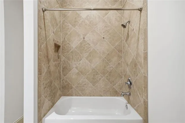 a bathroom with a granite countertop sink toilet and mirror
