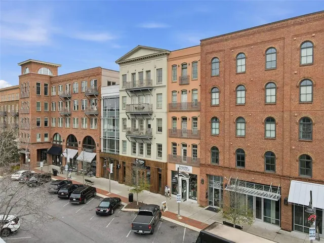 a front view of a building with parking space