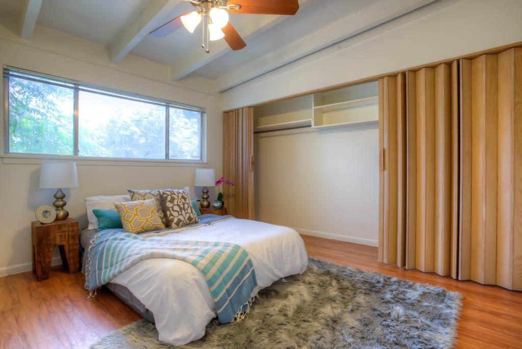 3011 Whitis Avenue, Unit 101 Austin, TX 78705 - Photo 5 of 7 Bedroom with light wood-type flooring and ceiling fan