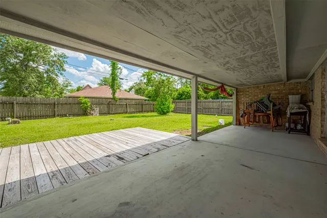 a view of yard with swimming pool and green space