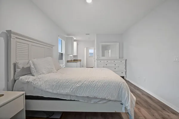 a bedroom with a bed and a couch