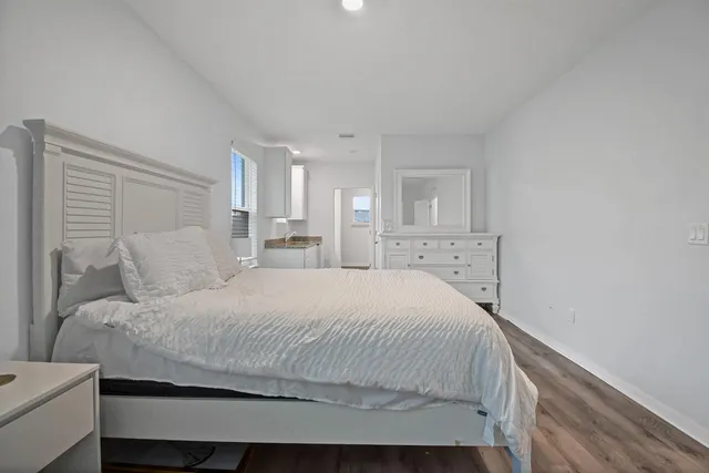 a bedroom with a bed and a couch